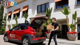 Toyota-backed self driving company Pony.ai demonstrates an autonomous electric vehicle delivery from local e-commerce platform Yamibuy, during the outbreak of the coronavirus disease (COVID-19) in Irvine, California, U.S., April 28, 2020. (REUTERS/Mike Bl