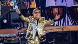 FILE - Elton John performs during Glastonbury Festival in Worthy Farm, Somerset, England, Sunday, June 25, 2023. (Joel C Ryan/Invision/AP)