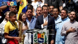 Venezuelan opposition leader Juan Guaido sings the national anthem during a rally held by his supporters against Venezuelan President Nicolas Maduro's government, in Caracas, Venezuela March 4, 2019. (REUTERS/Carlos Garcia Rawlins)