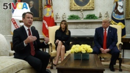 President Donald Trump and first lady Melania Trump listen as acting FDA Commissioner Ned Sharpless talks about a plan to ban most flavored e-cigarettes, in the Oval Office of the White House, Wednesday, Sept. 11, 2019, in Washington. (AP Photo/Evan Vucci