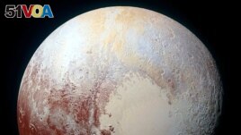 A heart shaped region named Sputnik Planum is seen in an enhanced view of Pluto in this undated image from NASA's New Horizons spacecraft, which flew past the dwarf planet in 2015. (REUTERS/NASA/JHUAPL/SwRI/Handout via Reuters)