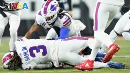 Buffalo Bills football player Damar Hamlin (3) lies on the ground after making a tackle on Cincinnati Bengals player Tee Higgins. After getting up from the play, Hamlin collapsed and was administered CPR on the field. (AP Photo/Joshua A. Bickel)