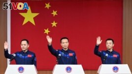 Astronauts Fei Junlong, Deng Qingming and Zhang Lu attend a news conference before the Shenzhou-15 spaceflight mission to build China's space station, at Jiuquan Satellite Launch Center, near Jiuquan, Gansu province, China November 28, 2022. (cnsphoto via REUTERS )