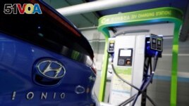 FILE - A Hyundai Motor's electric car IONIQ is charged at a electric charging station in Seoul, South Korea, Dec. 11, 2018. 