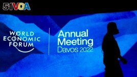 Workers set the stage prior to the annual meeting of the World Economic Forum, in Davos, Switzerland, Sunday, May 22, 2022. 