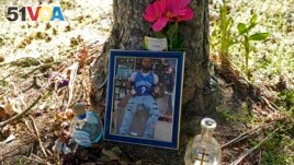A memorial for Christopher Roberts Jr., who was killed in a 2020 shooting in the parking lot of a Safeway store in Seattle's Rainier Beach neighborhood, is shown Tuesday, July 12, 2022 