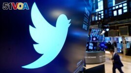 The logo for Twitter appears above a trading post on the floor of the New York Stock Exchange in this Nov. 29, 2021, file photo. 