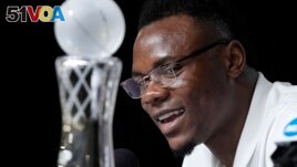 Oscar Tshiebwe of Kentucky decided not to go to the NBA even after winning the AP's Player of the Year award in Men's Basketball. (AP Photo/Gerald Herbert)