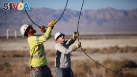 Linemen repair lines that were broken during a powerful earthquake that struck Southern California, near the epicenter, northeast the city of Ridgecrest, California, July 4, 2019.