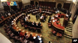 Members of New York's Electoral College meet in the New York state Senate Chamber to elect President Barack Obama and Vice President Joseph Biden, in Albany, N.Y., December 17, 2012.
