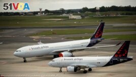 FILE - Two planes from Brussels Airlines are shown in this file photo on one of the routes for planes at Brussels Airport in Brussels on May 12, 2020. (AP Photo/Francisco Seco, File)