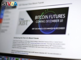This Friday, Dec. 8, 2017, photo shows the Chicago Board Options Exchange website announcing that bitcoin futures will start trading on the CBOE on Sunday evening, Dec. 10.