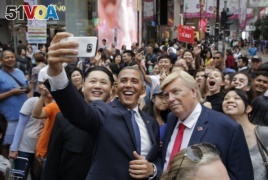 Impersonators of North Korean leader Kim Jong Un, former U.S. President Barack Obama and U.S. President Donald Trump take selfies in Hong Kong on July 4, 2017.