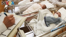 FILE - This Thursday, Feb. 16, 2017 file photo shows newborn babies in the nursery of a postpartum recovery center in upstate New York.