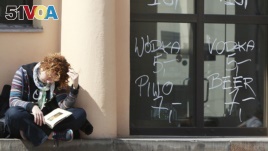 A girl reads a book in Warsaw, Poland, April 26, 2016. (AP Photo/Czarek Sokolowski)