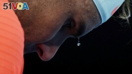A bead of sweat drips from Spain's Rafael Nadal during his second round match against Michael Mmoh of the U.S., February 11, 2021. (REUTERS/Loren Elliott)