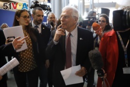 European Union foreign policy chief Josep Borrell is surrounded by reporters at the European parliament, Jan.14, 2020 in Strasbourg, eastern France.
