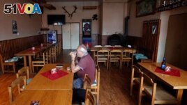 A customer drinks a beer inside the U Kryslu pub in the village of Sec near the town of Blovice, Czech Republic, June 28, 2022. (REUTERS/David W Cerny)