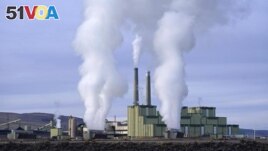 FILE - Steam billows from a coal-fired power plant Nov. 18, 2021, in Craig, Colo. The Supreme Court on Thursday, June 30, 2022, limited how the nation's main anti-air pollution law can be used to reduce carbon dioxide emissions from power plants. (AP Photo/Rick Bowmer, File)