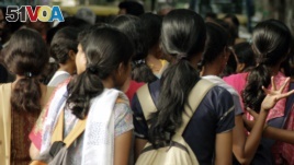 Women stand at a crowded place in the southern Indian city of Bangalore, Oct. 9, 2006. Safety is the biggest concern for women using public and private transport.
