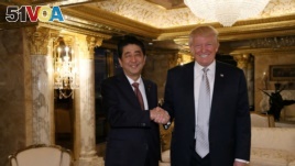 Japan's Prime Minister Shinzo Abe meets with U.S. President-elect Donald Trump at Trump Tower in New York, on November 17, 2016. Cabinet Public Relations Office/HANDOUT via Reuters