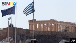 Greece reached an agreement with Europe on its debt. But debt campaigners say many developing countries are falling into a debt trap. (AP Photo/Thanassis Stavrakis)