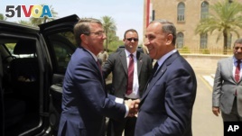 Visiting U.S. Defense Secretary Ash Carter, left, shakes hands with Iraqi Defense Minister Khaled al-Obeidi at the Ministry of Defense, Baghdad, Iraq, July 11, 2016. 