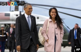 President Barack Obama jokes with his daughter Malia Obama as they walk to board Air Force One from the Marine One helicopter Thursday, April 7, 2016. The White House announced Sunday that Malia will wait a year to begin college at Harvard University.  (AP Photo/Jacquelyn Martin)