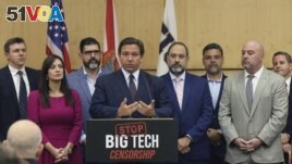 Florida Gov. Ron DeSantis gives his opening remarks - prior to signing legislation that seeks to punish social media companies that remove 
