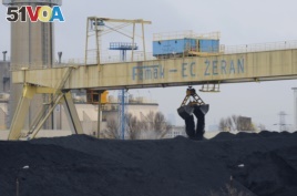 Coal is transported at a heating plant in Warsaw, Poland, March 2012.