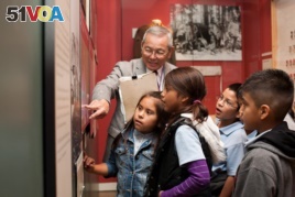 Mas Yamashita leads a school tour at the Japanese American National Museum where he volunteers every Friday. Yamashita, an American born in California, is one of the 120,000 people held in an internment camp during the WWII. (Courtesy: Japanese American N