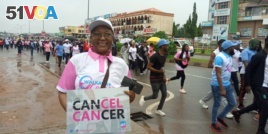 Cancer survivor Zainab Mohammad takes part in a cancer awareness walk in Abuja, Nigeria, Oct. 26, 2019. (Timothy Obiezu/VOA)
