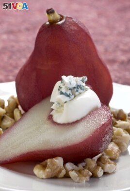 Red wine poached pears with blue cheese and walnuts are seen in this Aug. 30, 2010 photo. (AP Photo/Larry Crowe)