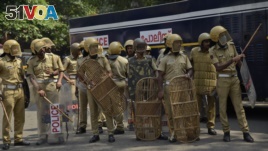 Policemen take position outside the state secretariat anticipating protests following reports of two women of menstruating age entering the Sabarimala temple, one of the world's largest Hindu pilgrimage sites, in Kerala state, India.