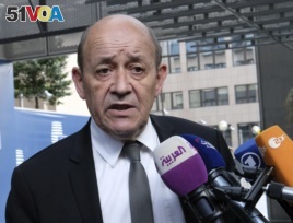 French Foreign Minister Jean-Yves Le Drian speaks with the press before meeting with German Foreign Minister Heiko Maas, British Foreign Secretary Boris Johnson, European Union foreign policy chief Federica Mogherini and Iranian Foreign Minister Javad Zarif earlier in May..