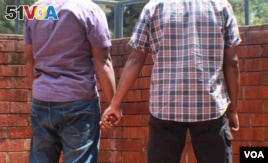 FILE - A Kenyan gay couple is seen holding hands. Homosexuality is illegal in at least 36 African countries, including Kenya. Penalties include prison and fines. (Photo - Rael Ombuor/VOA)