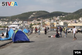 At the port in Lesbos, Greece, many refugees from Afghanistan, Iraq and Syria arrive seeking to go to other places in Europe. (Credit: Heather Murdock/VOA)