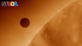 This handout image, courtesy of NASA, shows the planet Venus at the start of its transit of the Sun, June 5, 2012. (REUTERS/NASA/AIA/Solar Dynamics Observatory/Handout)