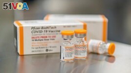 This October 2021 photo provided by Pfizer shows kid-size doses of its COVID-19 vaccine in Puurs, Belgium. The drug-maker says the vaccine appears safe and nearly 91% effective at preventing symptomatic infections in 5- to 11-year-olds.