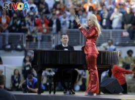 Lady Gaga sings the national anthem before the NFL Super Bowl 50 football game.
