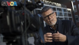 Emile Ratelband answers questions during an interview in Utrecht, Netherlands, Thursday, Nov. 8, 2018. (AP Photo/Peter Dejong)