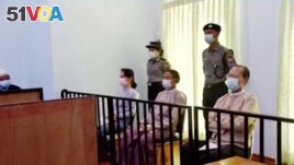 FILE - Myanmar's ousted leader Aung San Suu Kyi, former president Win Myint and doctor Myo Aung appear at a court in Naypyitaw, Myanmar May 24, 2021, in this still image taken from video. (MRTV/REUTERS TV/via REUTERS)