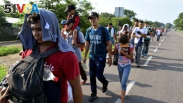 Migrants from Central America walk on a highway during their journey towards the United States, in Ciudad Hidalgo, Chiapas state, Mexico, June 5, 2019. (REUTERS/Jose Torres)