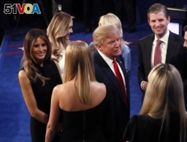 Donald Trump talks to his family after debate.
