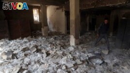 The remains of burned ancient books and manuscripts are seen inside Mosul's heavily damaged museum, March 8, 2017.