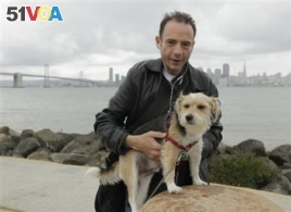 This 2011 photo shows Timothy Ray Brown, the only man ever known to have been apparently cured from AIDS, with his dog, Jack, on Treasure Island in San Francisco. (Courtesy Photo)