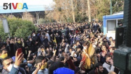In this Saturday, Dec. 30, 2017 photo taken by an individual not employed by the Associated Press, university students attend a protest inside Tehran University .