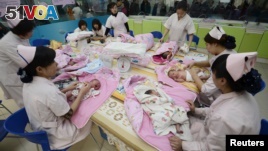 Infants undergo a daily medical examination at a maternal and child health care hospital in Taiyuan. Experts say China's new two-child policy could spur economy because more child-related service will be needed.