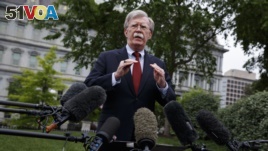 Former national security adviser John Bolton talking to reporters outside the White House last May. He resigned Tuesday, September 19, 2019.