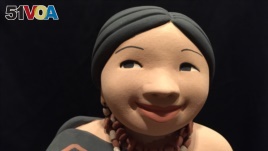 A closer look at one of Kathleen Wall's ceramic dolls. (J.Taboh/VOA)